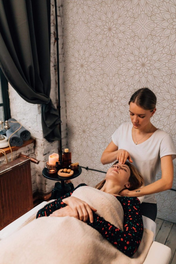 industrial style spa massage room decorated with Mandala floral peel and stick wallpaper