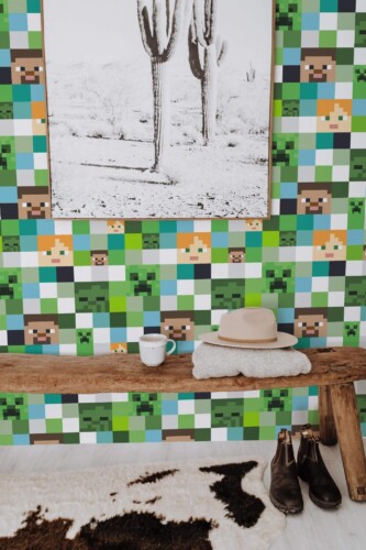 Minecraft peel and stick wallpaper with pixel characters in green and blue accent wall entryway with rustic bench
