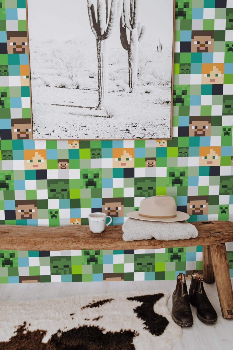 Minecraft peel and stick wallpaper with pixel characters in green and blue accent wall entryway with rustic bench