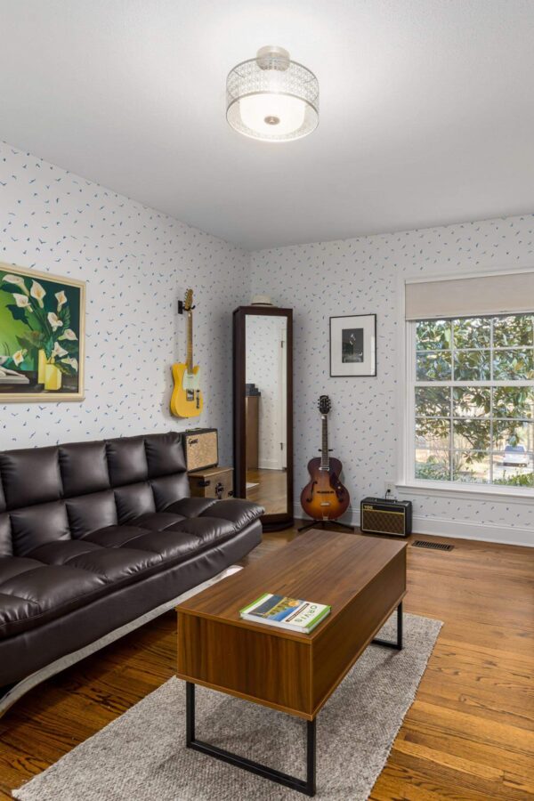 Mid-century style living room decorated with Minimalist birds peel and stick wallpaper and music instruments