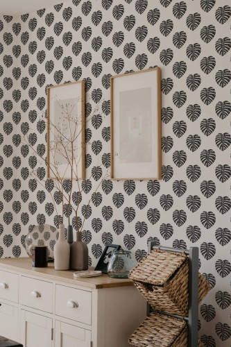 Scandinavian style bedroom decorated with Minimalist Monstera leaf peel and stick wallpaper