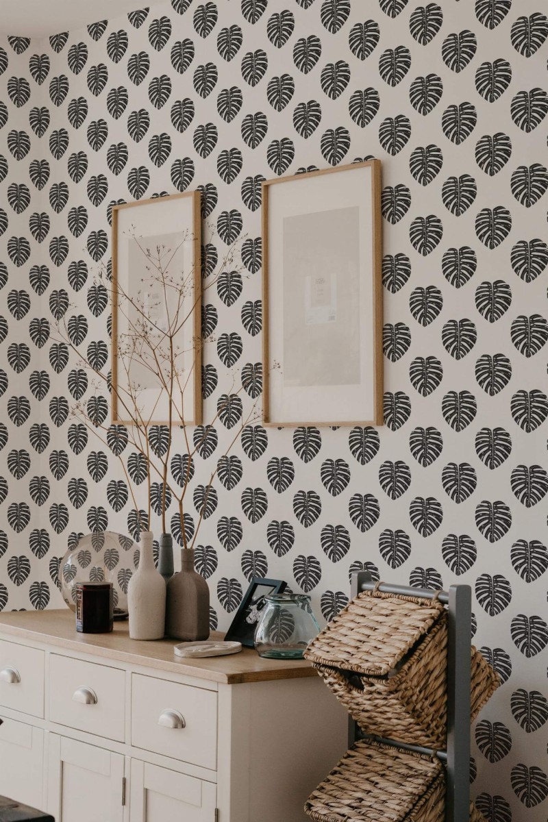 Scandinavian style bedroom decorated with Minimalist Monstera leaf peel and stick wallpaper