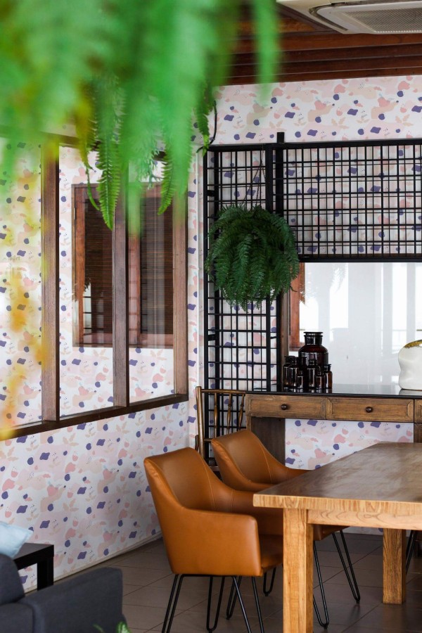 Mid-century modern style dining room decorated with Modern abstract shapes peel and stick wallpaper and black industrial accents