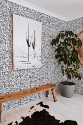 Fancy Walls peel and stick wallpaper with black and white Montezuma abstract animal pattern for modern bold interiors.