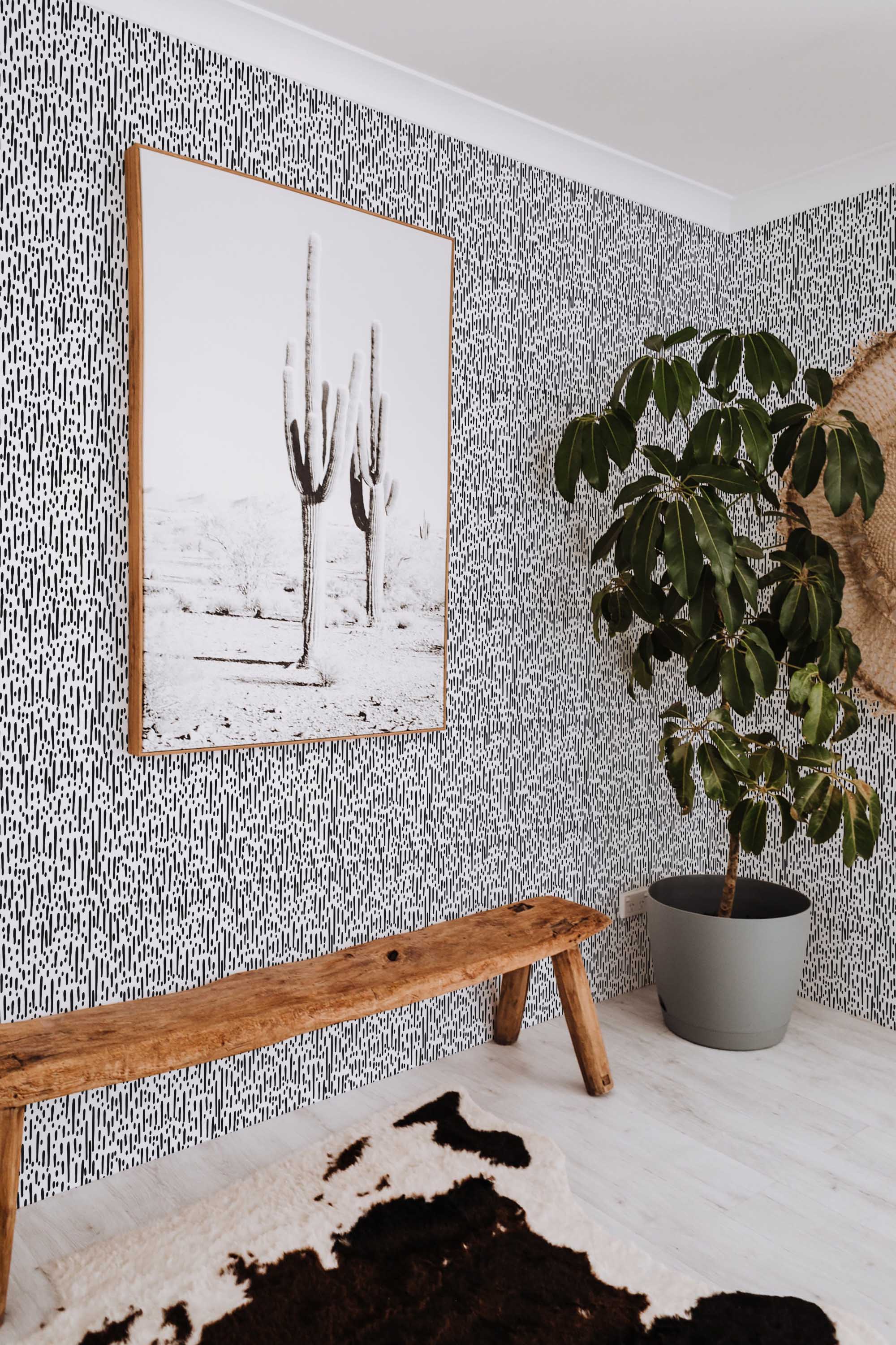 Fancy Walls peel and stick wallpaper with black and white Montezuma abstract animal pattern for modern bold interiors.