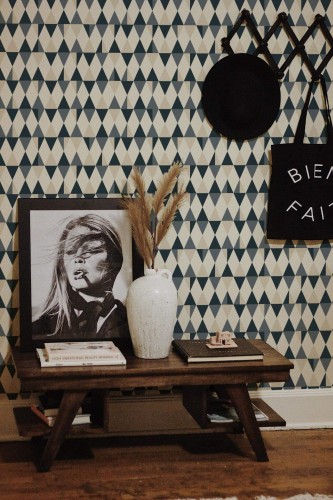 Rustic farmhouse style entryway decorated with Multicolor geometric triangle peel and stick wallpaper