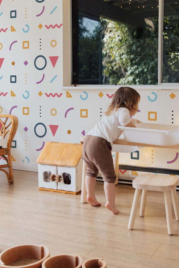 Bohemian style kids room decorated with Multicolor memphis peel and stick wallpaper