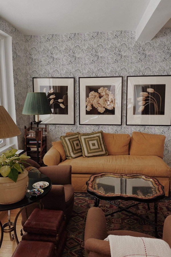 Mid-century eclectic style living room decorated with Multicolored monstera leaf peel and stick wallpaper