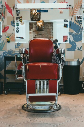 Peel and stick wall murals by Fancy Walls featuring barbershop crocodile