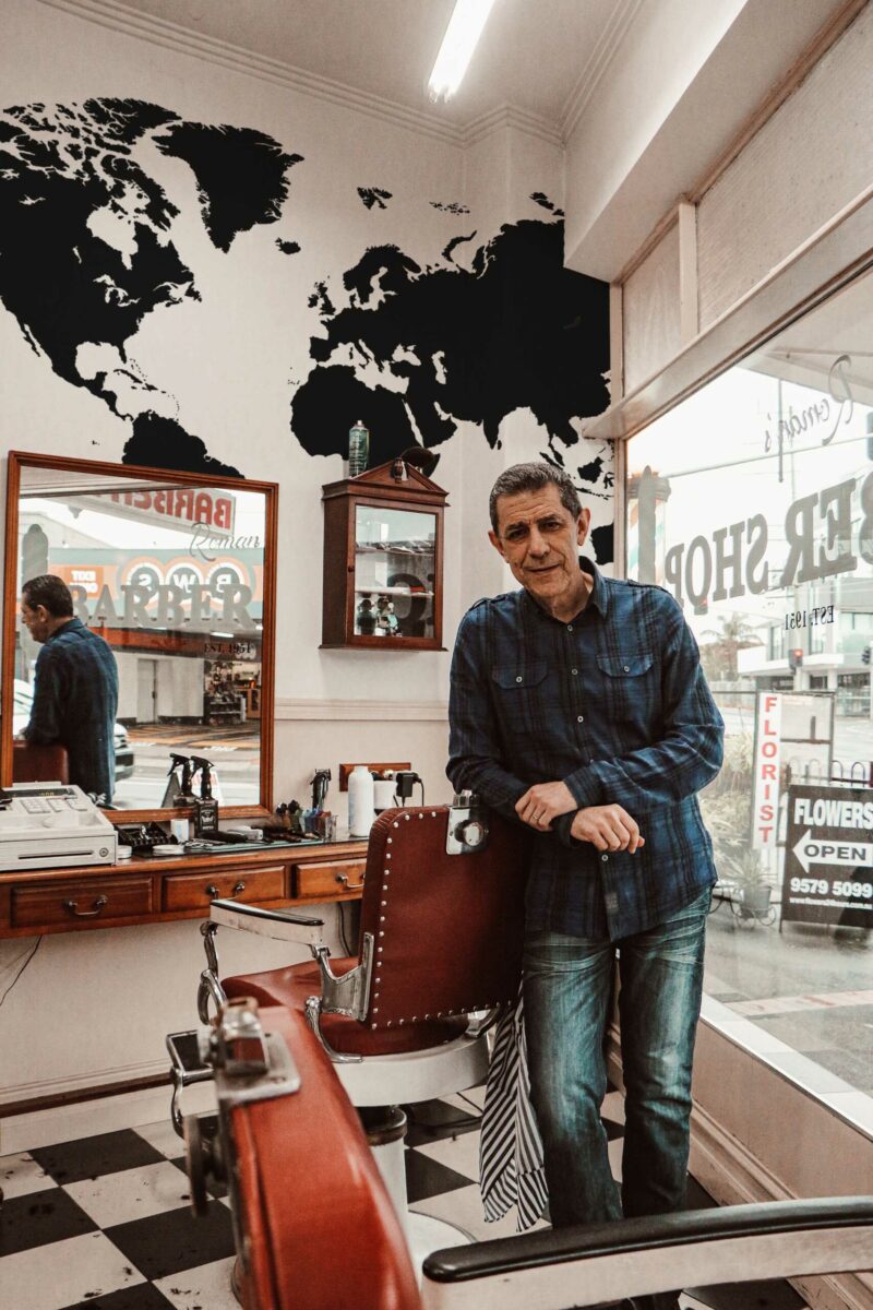 Sleek World Contours wall mural with bold black and white world map design, perfect for barbershops, bars, and creative walls.