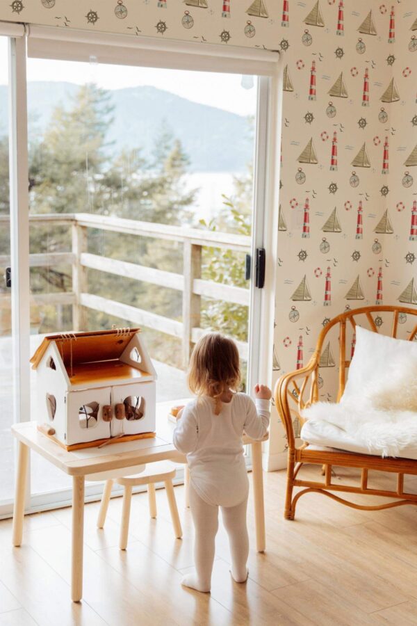 Boho gender neutral style kids room decorated with Nautical lighthouse peel and stick wallpaper