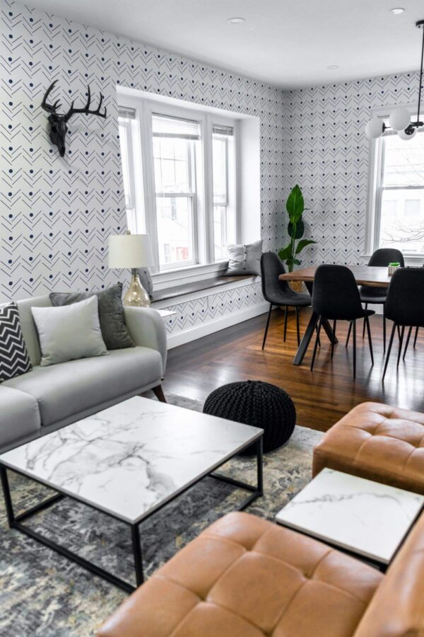 Mid-century modern scandinavian style living dining room decorated with Navy blue herringbone peel and stick wallpaper