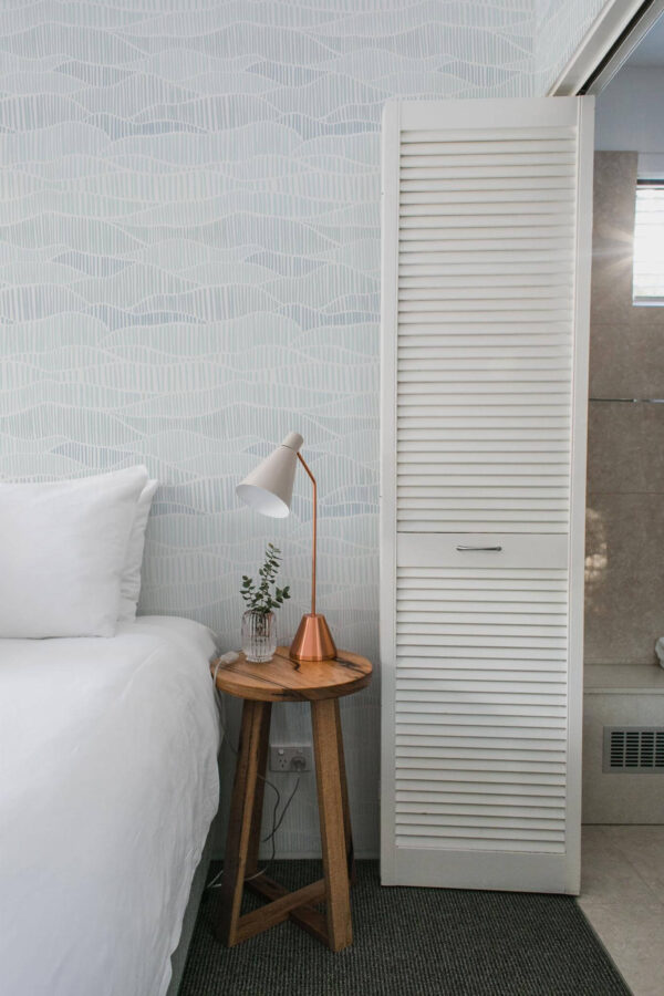 Minimalist style bedroom decorated with Neutral blue line art peel and stick wallpaper