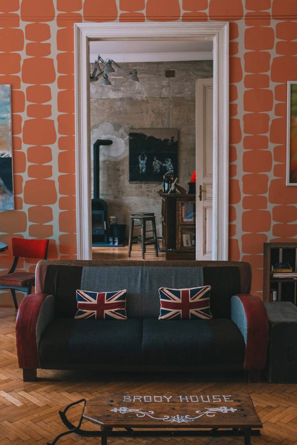 Industrial rustic style living dining room decorated with Orange retro peel and stick wallpaper