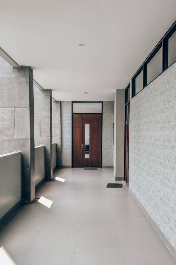 Industrial style hallway with a balcony decorated with Organic pattern peel and stick wallpaper
