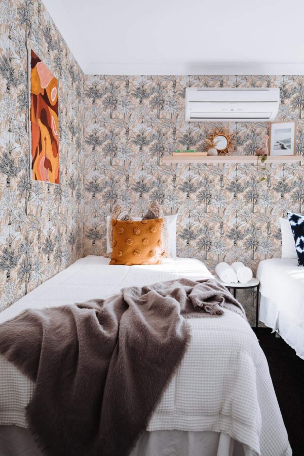 Boho style bedroom decorated with Palm tree peel and stick wallpaper