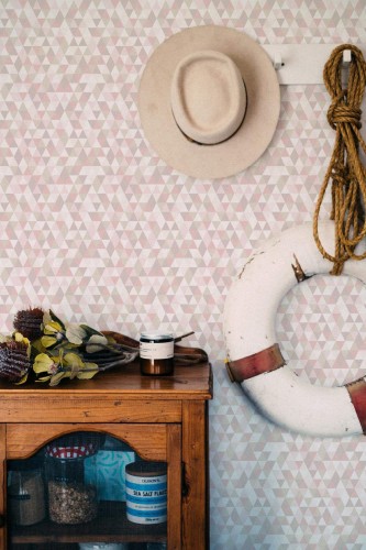 Coastal nautical style living room decorated with Pastel nursery triangle peel and stick wallpaper