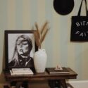Rustic farmhouse style entryway decorated with Pastel striped peel and stick wallpaper