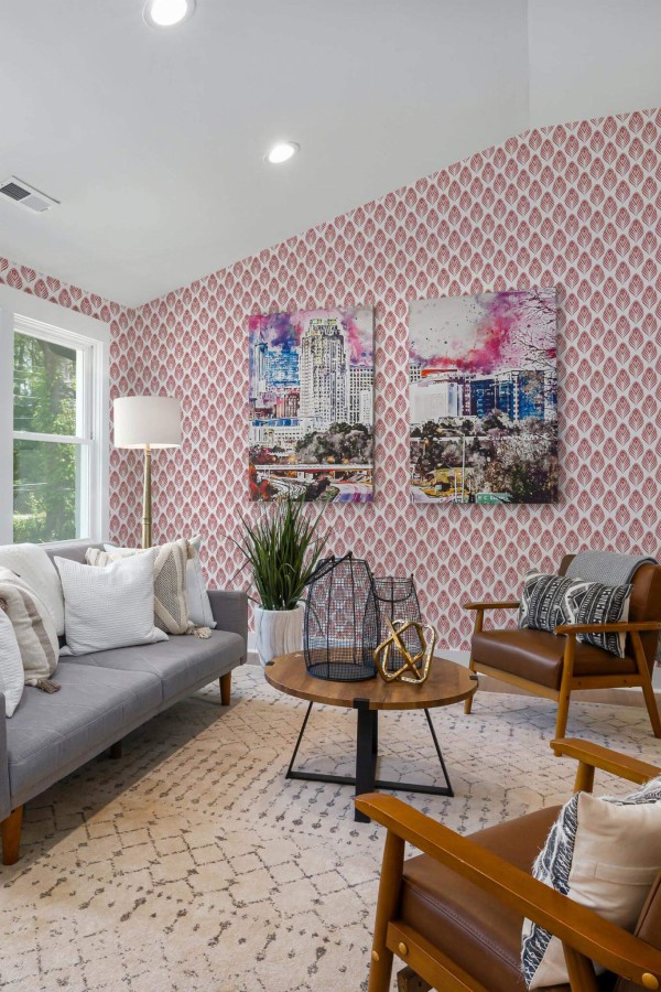 Mid-century modern style living room decorated with Peacock Feather peel and stick wallpaper and colorful funky artwork