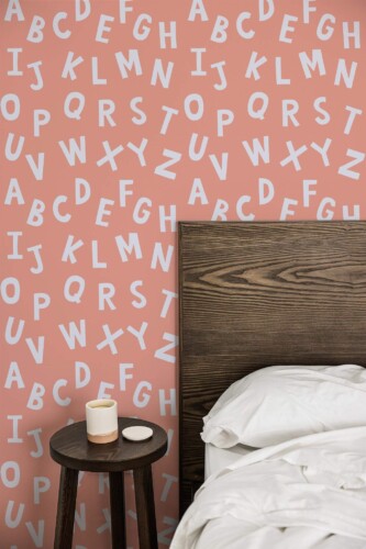 Farmhouse style bedroom decorated with Pink alphabet peel and stick wallpaper