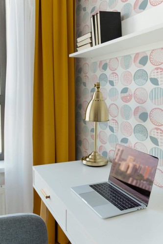 Scandinavian style home office decorated with Pink and blue boho circles peel and stick wallpaper