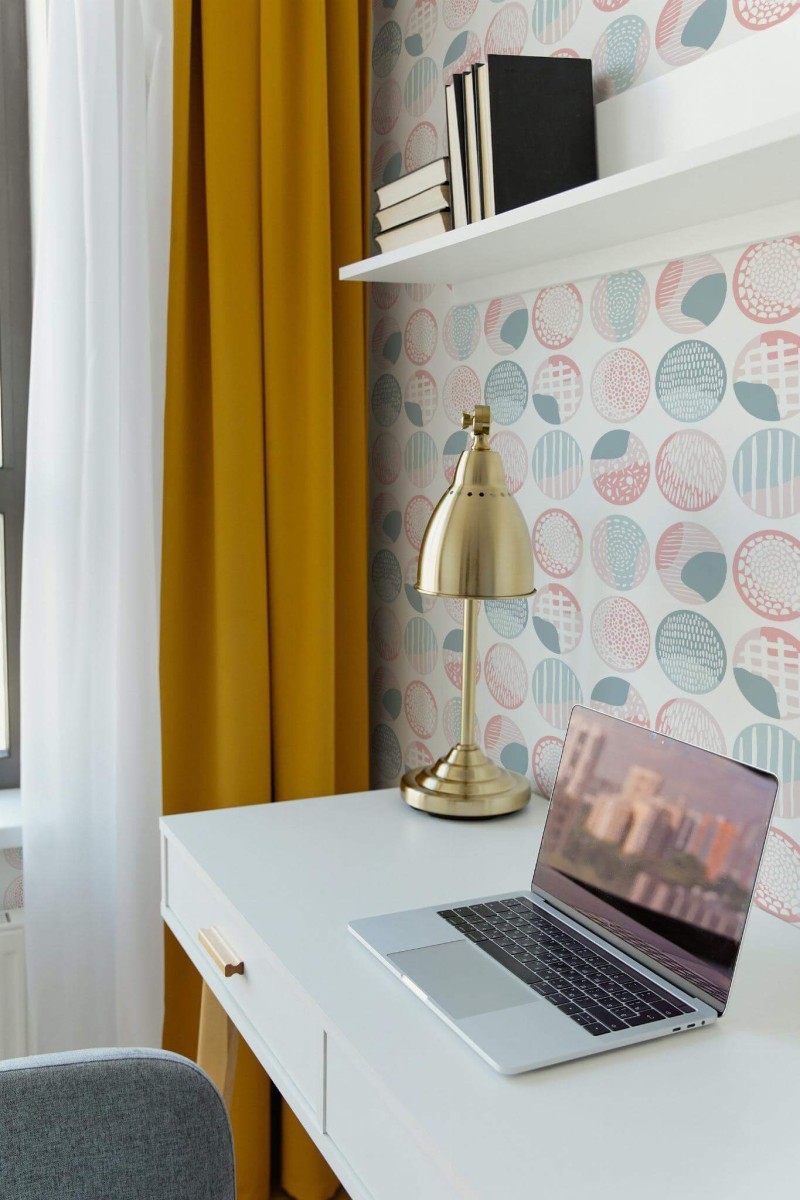 Scandinavian style home office decorated with Pink and blue boho circles peel and stick wallpaper