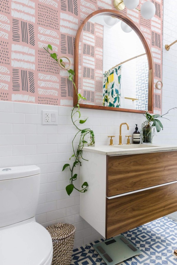Boho scandinavian style powder room decorated with Pink and white lines peel and stick wallpaper
