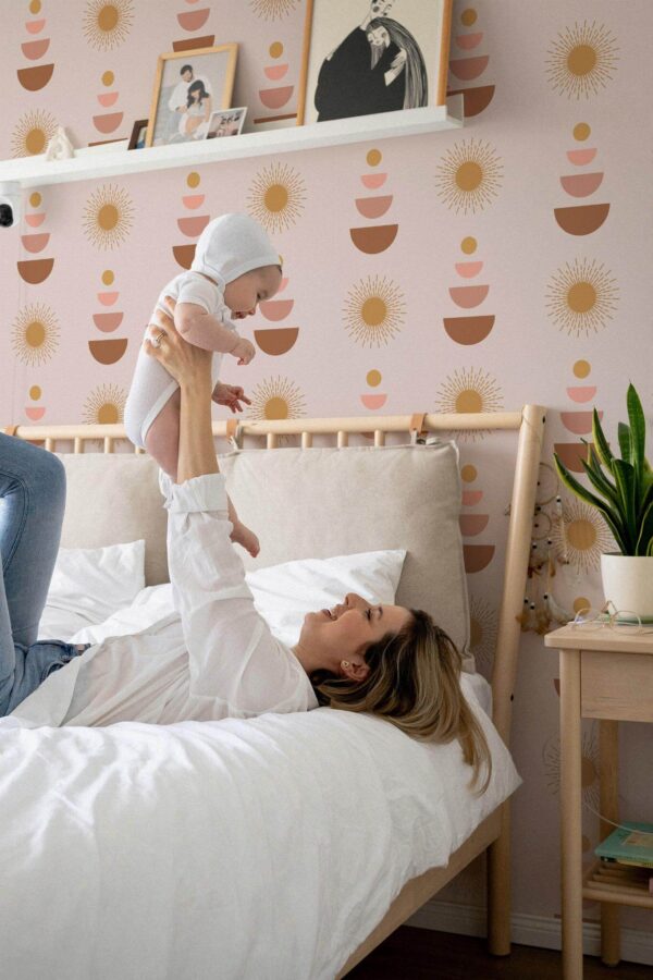 Neutral style nursery decorated with Pink boho peel and stick wallpaper