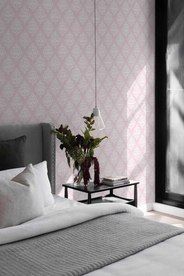 Scandinavian style bedroom decorated with Pink damask peel and stick wallpaper
