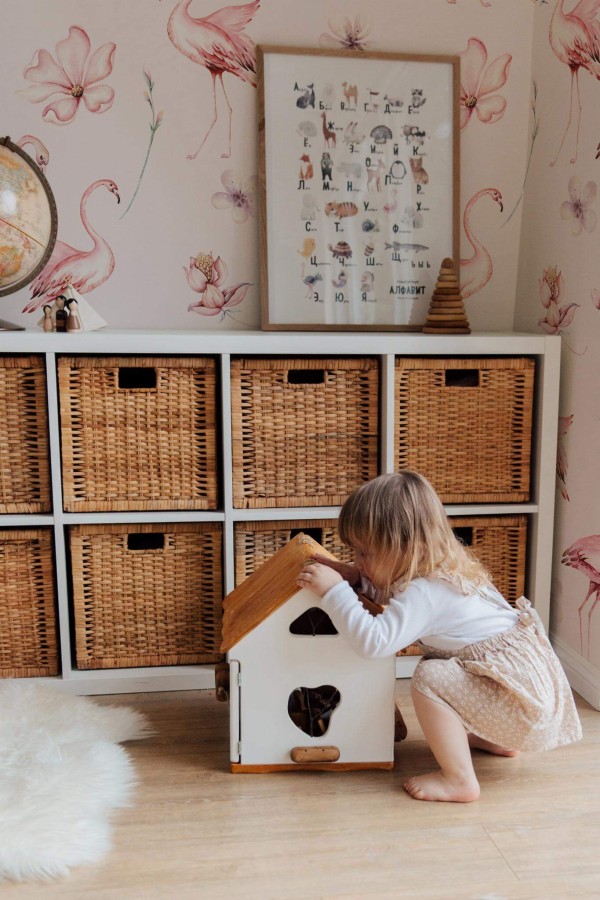 Boho gender neutral style kids room decorated with Pink flamingo peel and stick wallpaper