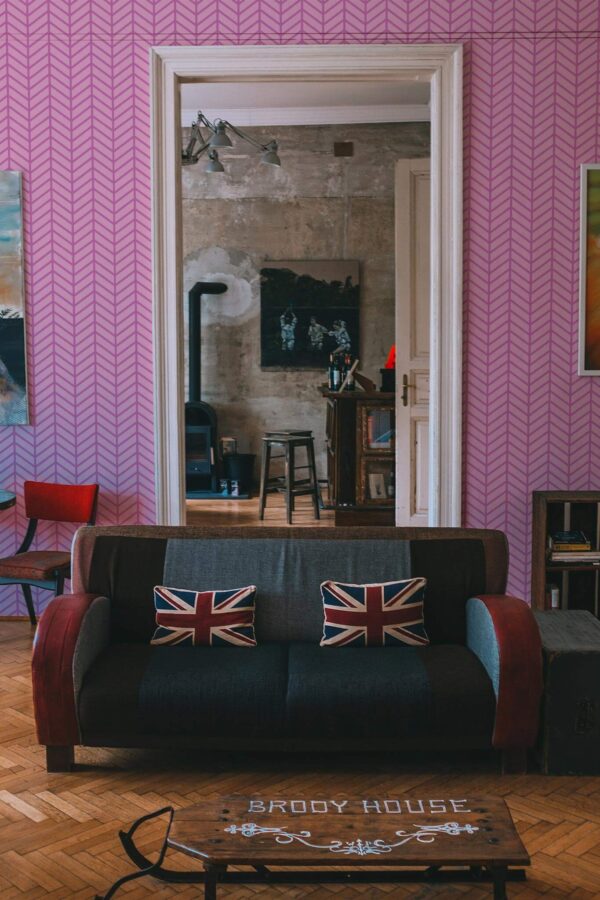Industrial rustic style living dining room decorated with Pink geometric herringbone peel and stick wallpaper