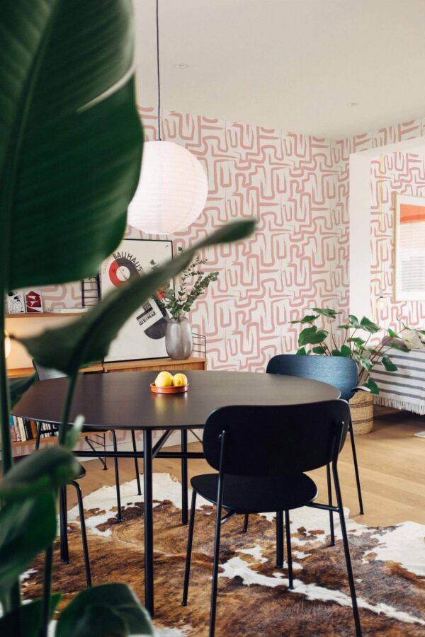 Scandinavian style dining room decorated with Pink maze peel and stick wallpaper