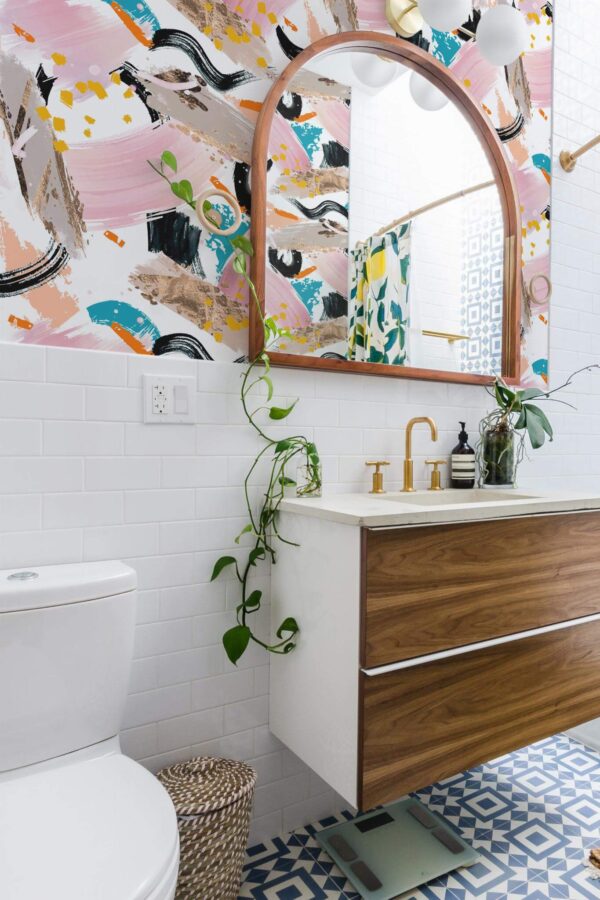 Boho scandinavian style powder room decorated with Pink paint stroke peel and stick wallpaper