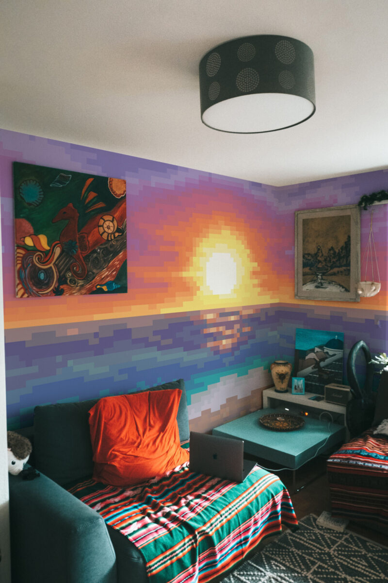 Pixel Sunset Wall Mural with a colorful pixelated coastal sunset, ideal for game rooms, media spaces, or creative coastal-inspired interiors.