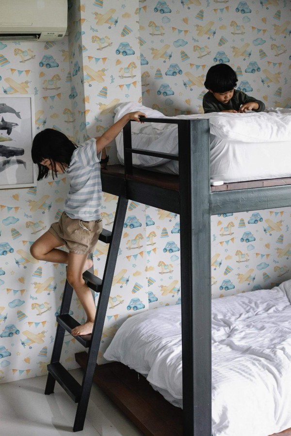 Minimalistic style kids room decorated with Plane car toys peel and stick wallpaper