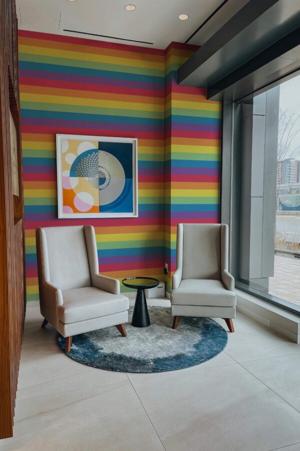 Mid-century-modern style living room decorated with Pride flag peel and stick wallpaper