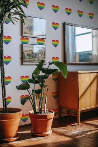 Mid-century modern style living room decorated with Rainbow hearts peel and stick wallpaper