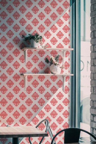 Industrial style cafe decorated with Red damask peel and stick wallpaper