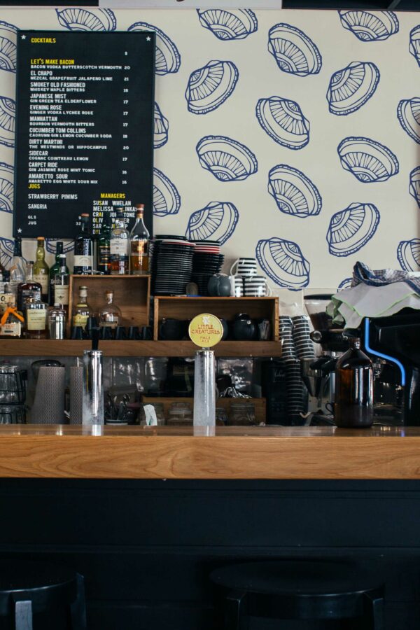 Fancy Walls peel and stick wallpaper with coastal bold seashells in blue