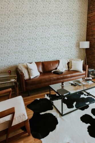 Fancy Walls showcasing a peel and stick wallpaper with cute Christmas doodles in green