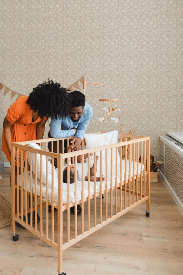 Boho style nursery decorated with Seamless wildflower peel and stick wallpaper