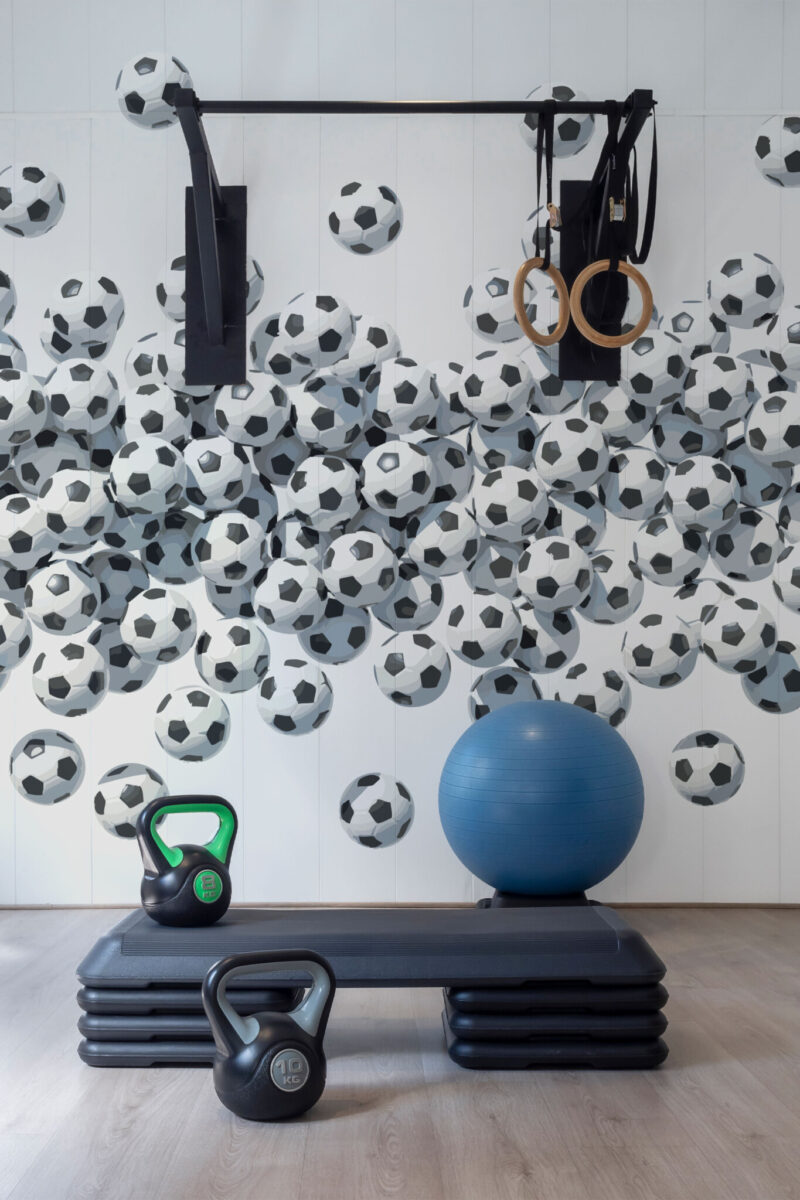 Creative Black and White Watercolor Football Wall Mural with artistic watercolor footballs in monochrome tones, ideal for gyms, game rooms, and sporty accent walls.