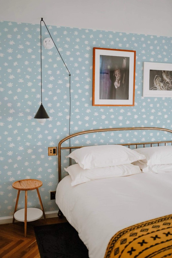 Minimal boho style bedroom decorated with Simple daisy floral peel and stick wallpaper