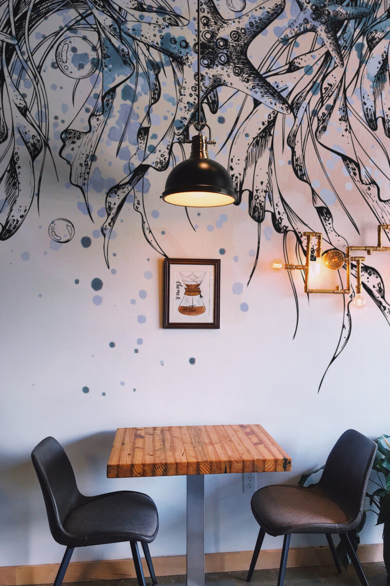 Nautical Dreamline Wall Mural with jellyfish, seashells, and ship’s rudders in blue and black on a white background, ideal for bathrooms and coastal-inspired spaces.