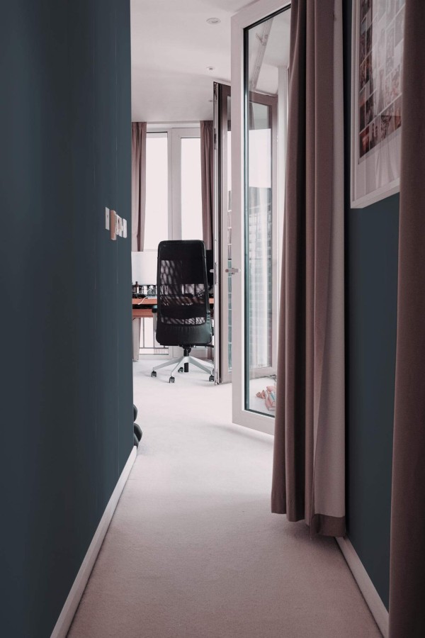 Modern scandinavian style hallway decorated with Solid charcoal peel and stick wallpaper