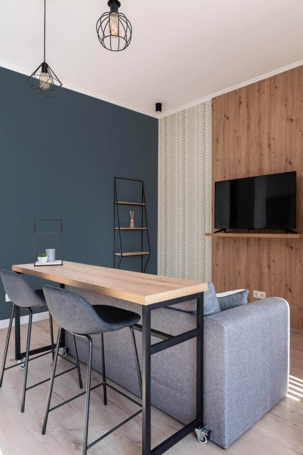 Scandinavian style open living room decorated with Solid charcoal peel and stick wallpaper