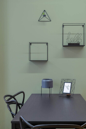 Industrial modern style dining room decorated with Solid color sage green peel and stick wallpaper