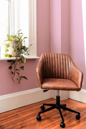 Mid-century modern style living room decorated with Solid pink peel and stick wallpaper