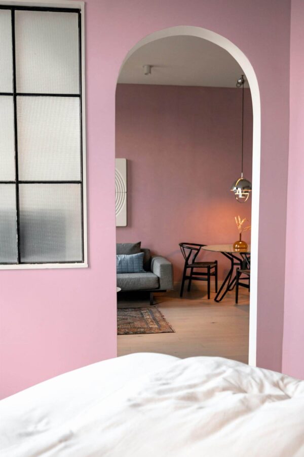 Modern scandinavian style living room decorated with Solid pink peel and stick wallpaper