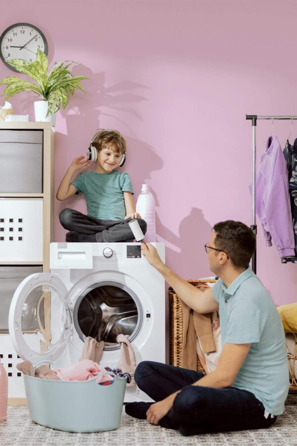 Scandinavian style laundry room decorated with Solid pink peel and stick wallpaper